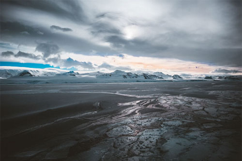 Cloudy skies over ice polar landscape