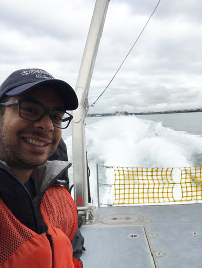 A young man on a research vessel at sea