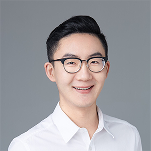 Scripps faculty member Wenyuan Fan, a smiling man with dark hair and glasses