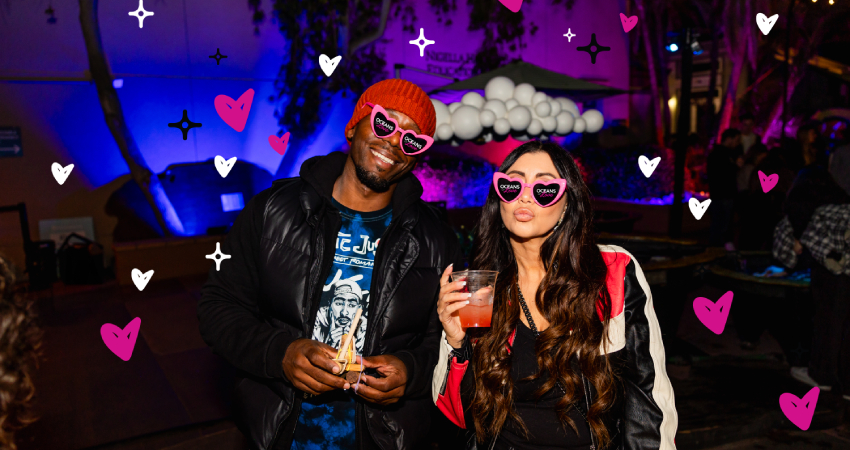 A couple enjoying Oceans at Night: Oceans of Love at Birch Aquarium