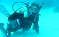 A woman scuba diving underwater