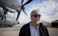Portrait of a man with U.S Air Force planes behind him