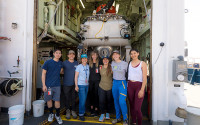 Scripps biological oceanographer and mission leader Lisa Levin (third from left) with students and colleagues before Alvin’s July 16 deployment