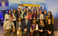 Members of the Scripps Oceanography contingent at COP28. Mitchell Chandler (third from left, back row) discussed the Argo network in the Ocean Pavilion during the event. 
