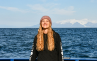 Kerstin doing fieldwork in the North Sea aboard the R/V Neil Armstrong, Iceland in the background