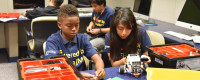 Two young students built robots using legos.
