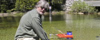 Mike Dettinger, a US Geological Survey hydrologist based at Scripps, takes part in research at a Sierra Nevada river.