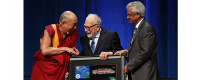 The Dalai Lama accepts a gift from Scripps Oceanography scientists Walter Munk and V. Ramanathan on his 80th birthday