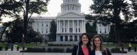Kat Montgomery (left) and Katherine Rainone (right) pose in front of the California State Capitol. 
