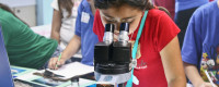 Girl looking in microscope