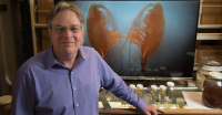 Scripps biological oceanographer and copepod expert Mark Ohman with image of namesake crustacean