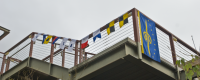 Signal flags spelling â€œSpiess Hallâ€ fly from the railing of the building newly named for Fred Spiess. (Jan. 23, 2009)