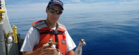 Scripps researcher Jim Leichter with barnacle-bearing bottles retrieved on Aug. 10, 2009 during SEAPLEX. 