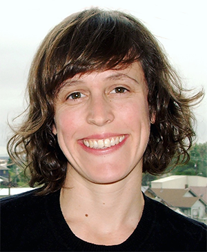Scripps faculty member Morgan Levy, a smiling woman with short brown hair