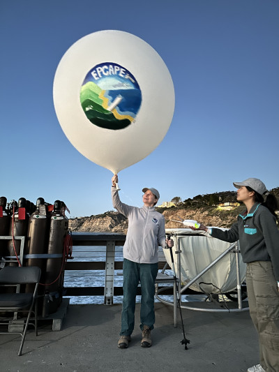 Lynn Russell, principal investigator of the yearlong Eastern Pacific Cloud Aerosol Precipitation Experiment (EPCAPE), launches the field campaign’s final radiosonde at 6 p.m. Pacific on February 14, 2024. The launch took place on the Ellen Browning Scripps Memorial Pier in La Jolla, California. Photo: Juarez Viegas, Los Alamos National Laboratory.