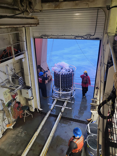 A CTD instrument covered in ice on a ship in the Arctic