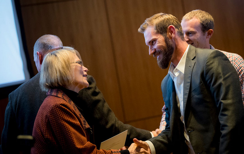 Brant Cheblowski, co-founder of California Seaweed Company and former MAS student, receives a congratulations from Scripps Director Margaret Leinen after participating in the Triton Innovation Challenge