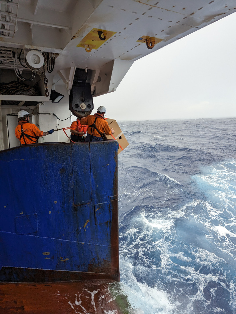 A Deep Argo float is deployed within a protective biodegradable cardboard box by NIWA ship crew behind NIWA's R/V Tangaroa. Photo: Mitchell Chandler