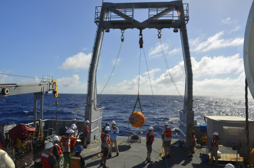 Deployment of a research buoy by scientists from Oregon State University and Scripps Oceanography