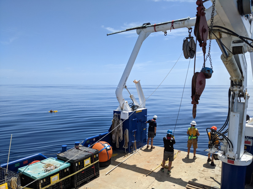 Scripps Institution of Oceanography at UC San Diego team recovering an acoustic recording package on a calm day in the Gulf of Mexico.