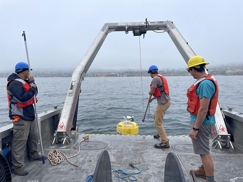 Oceanographers recover a Wirewalker buoy