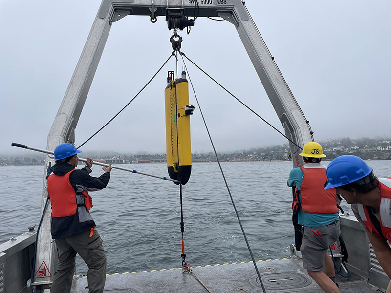 Oceanographers recover a Wirewalker vehicle