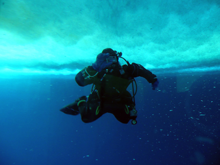 Jessica Meir scuba diving under the sea ice at a research camp called 