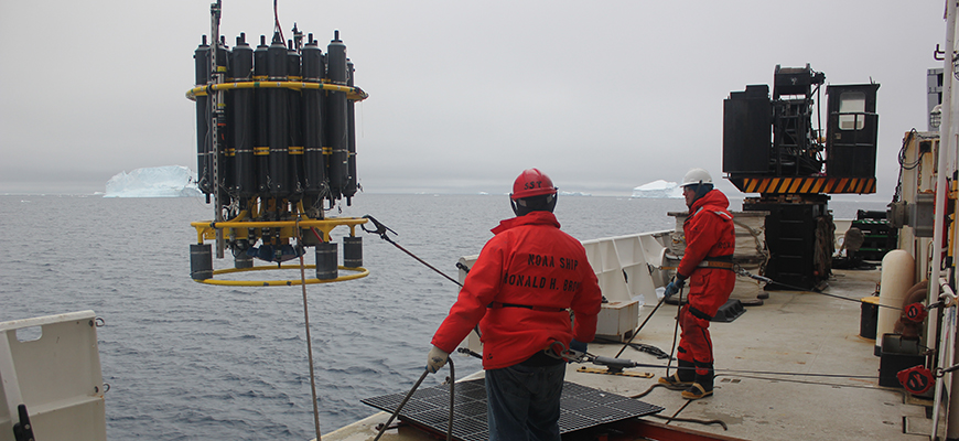 Crew of NOAA Ship Ronald M. Brown deploy a CTD, an instrument that collects ocean temperature and other data